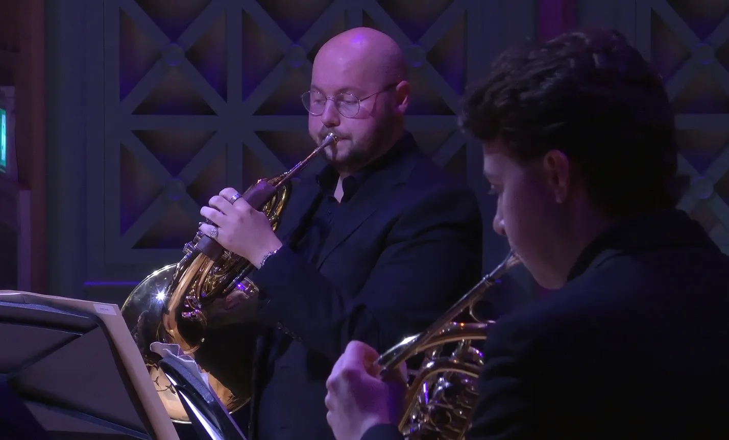 Tom playing in orchestra